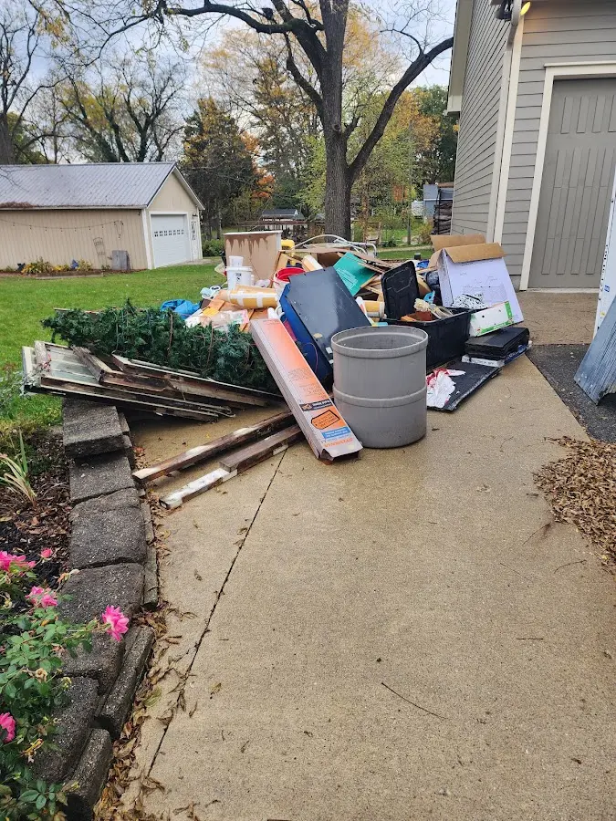 Dumpster being loaded with debris for Commercial Dumpster Rental in Waterford